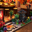 Close up of the front garden with stone lantern and plants