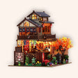 The Maple Teahouse lit miniature on a cream studio background