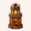 The Observatory, a round multi-tier astronomer's tower with a domed brass telescope, lit warm