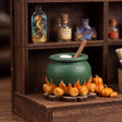 Close up of the painted cauldron on its printed flame base in The Potion Workshop