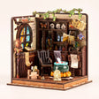 The Potion Workshop miniature roombox on a soft cream background