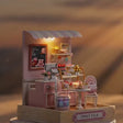 The Cake Shop lights glow to life, a calm product showcase