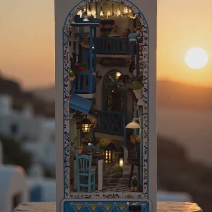 The Aegean Alley miniature Greek island book nook glowing at dusk, slow cinematic showcase