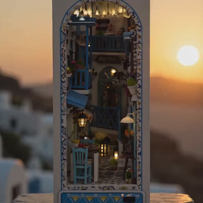 The Aegean Alley miniature Greek island book nook glowing at dusk, slow cinematic showcase