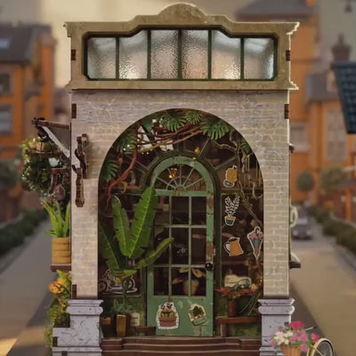 The Spring Conservatory miniature greenhouse showcase, lights glow to life among the plants