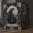 The Clockwork Apothecary book nook lighting up, brass gears and emerald glow