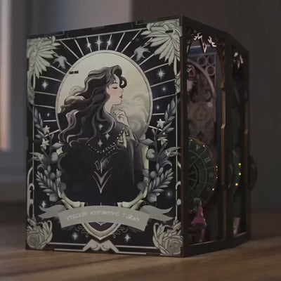 The Clockwork Apothecary book nook lighting up, brass gears and emerald glow