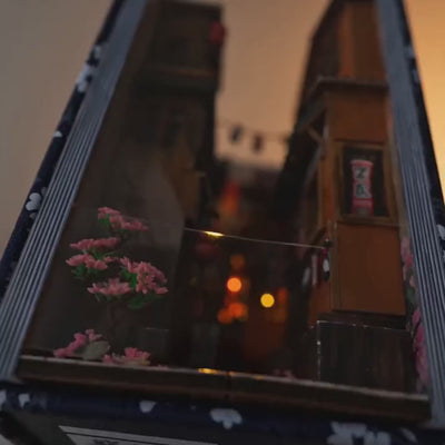 The Lantern Alley book nook showcase, the warm lanterns glowing to life down a Japanese alley at dusk