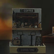 The Espresso Bar showcase, the lit coffee bar interior glows to life