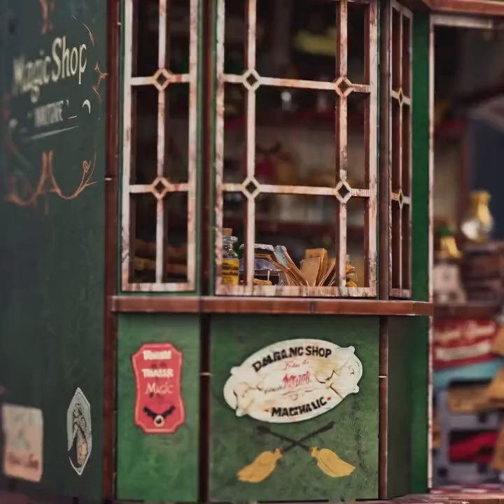 The Enchantment Shop kit showcase, the lit green wizard's magic shopfront glowing to life