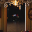The Christmas Parlour miniature roombox showcase, lights glowing to life