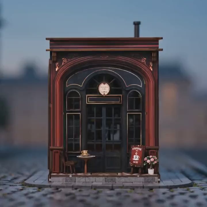 The Coffee Corner miniature coffee shop showcase, lights glowing warm