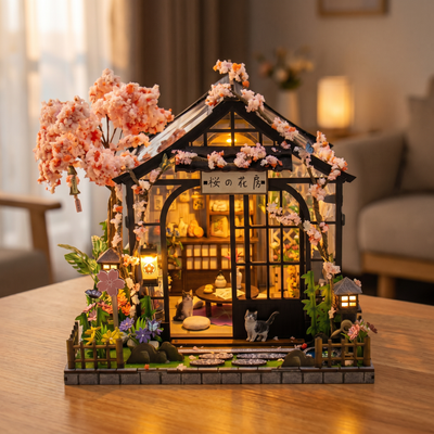 The Sakura Teahouse DIY miniature kit showcase, lit and rotating on a bright tabletop