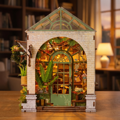 The Spring Conservatory miniature greenhouse showcase, lights glow to life among the plants