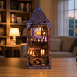The Arcane Tower DIY book nook showcase, interior lights glowing warm in a wizard study tower