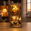 The Artist's Studio book nook showcase, lights glowing to life