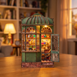 The Enchantment Shop kit showcase, the lit green wizard's magic shopfront glowing to life