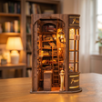 The Wand Shop book nook showcase, warm lights glowing to life over shelves of wand boxes