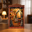The Snow Cabin DIY book nook showcase, the cabin window glows warm as snow drifts