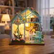 Hands assembling The Floral Reverie miniature greenhouse kit