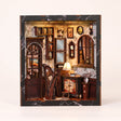 The Music Room miniature Victorian music room showcase, lights glowing to life