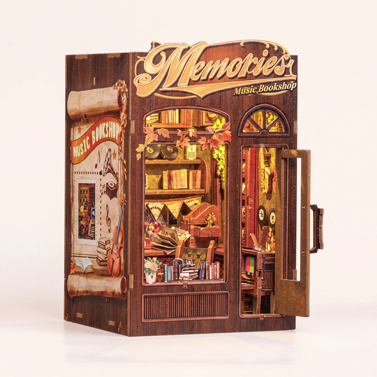The Record Shop book nook assembled by hand, then the warm interior lights come on behind the gold Memories sign
