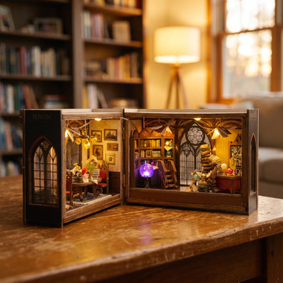 Hands assembling The Grimoire School miniature kit, ending with the lights switching on