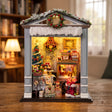 Hands assembling The Holly Porch miniature kit, ending with the light switching on
