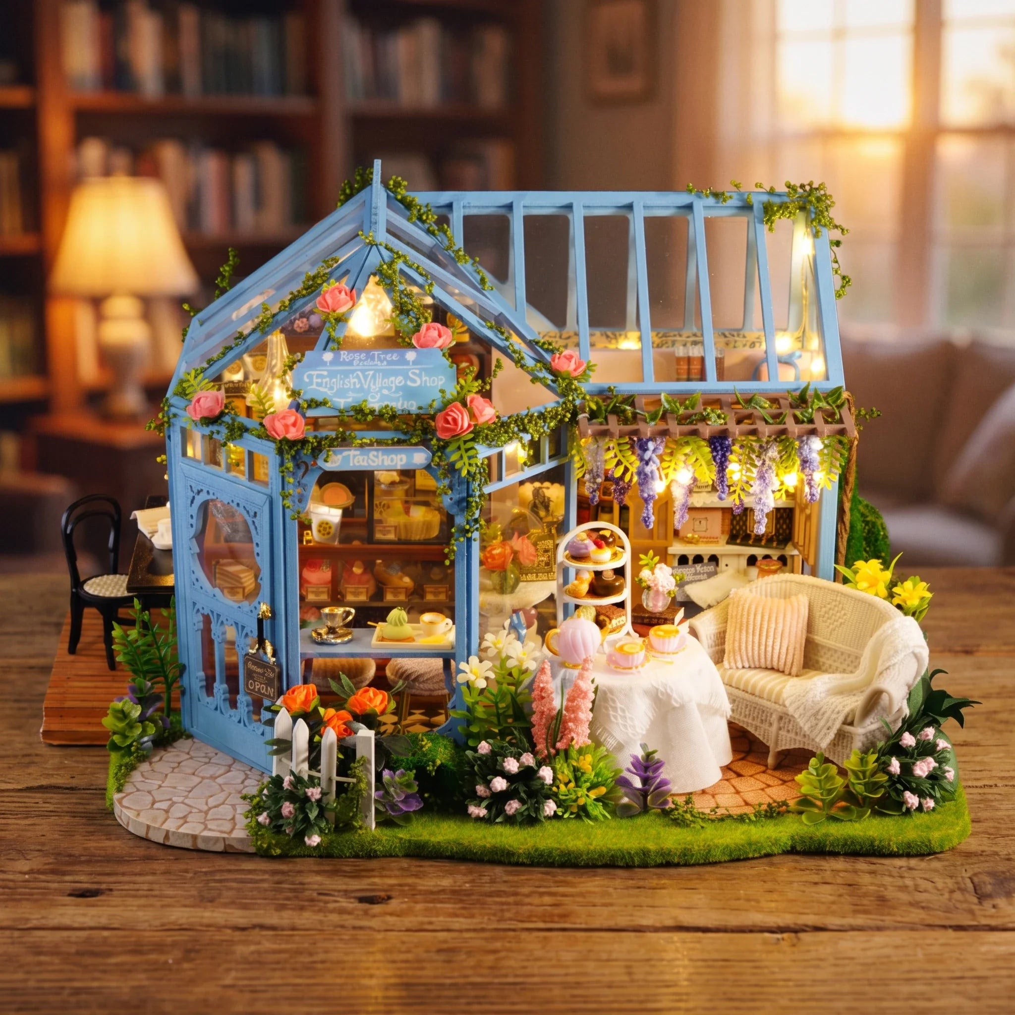 Hands assembling The Rose Glasshouse miniature kit, ending with the lights switching on