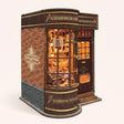 The Wand Shop book nook showcase, warm lights glowing to life over shelves of wand boxes