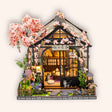 The Sakura Teahouse DIY miniature cherry blossom greenhouse kit on a cream background