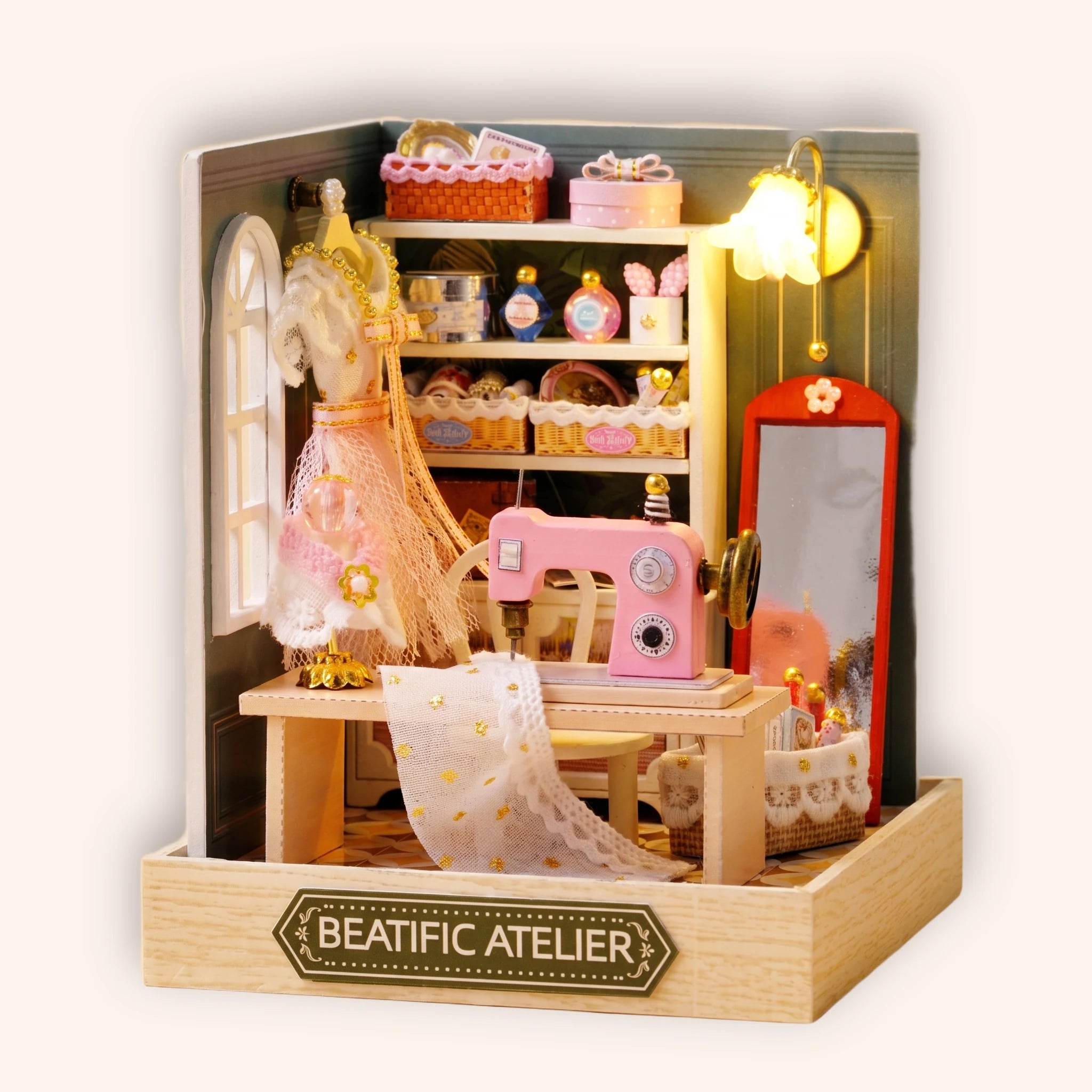 The Sewing Corner DIY miniature dressmaker roombox, warm LED lit, on cream background