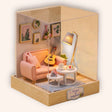 The Sunday Lounge miniature living room music corner with pink loveseat, guitar and glowing floor lamp on cream background