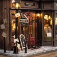 Entrance detail: red doors, chalkboard menu and street lamp