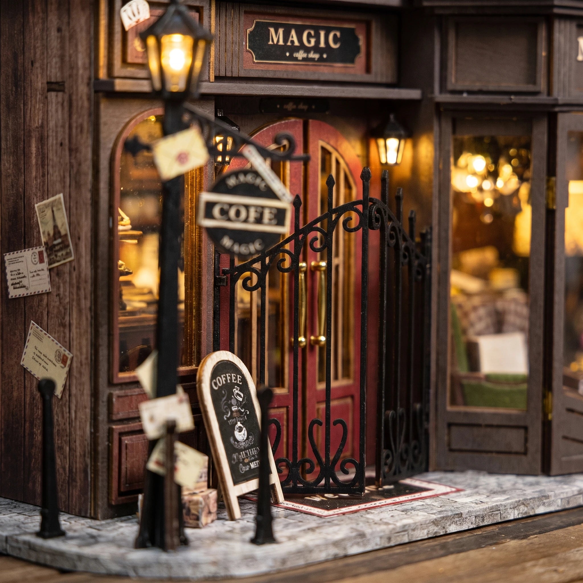 Entrance detail: red doors, chalkboard menu and street lamp