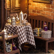 Sitting corner detail: checked tablecloth and silver kettle