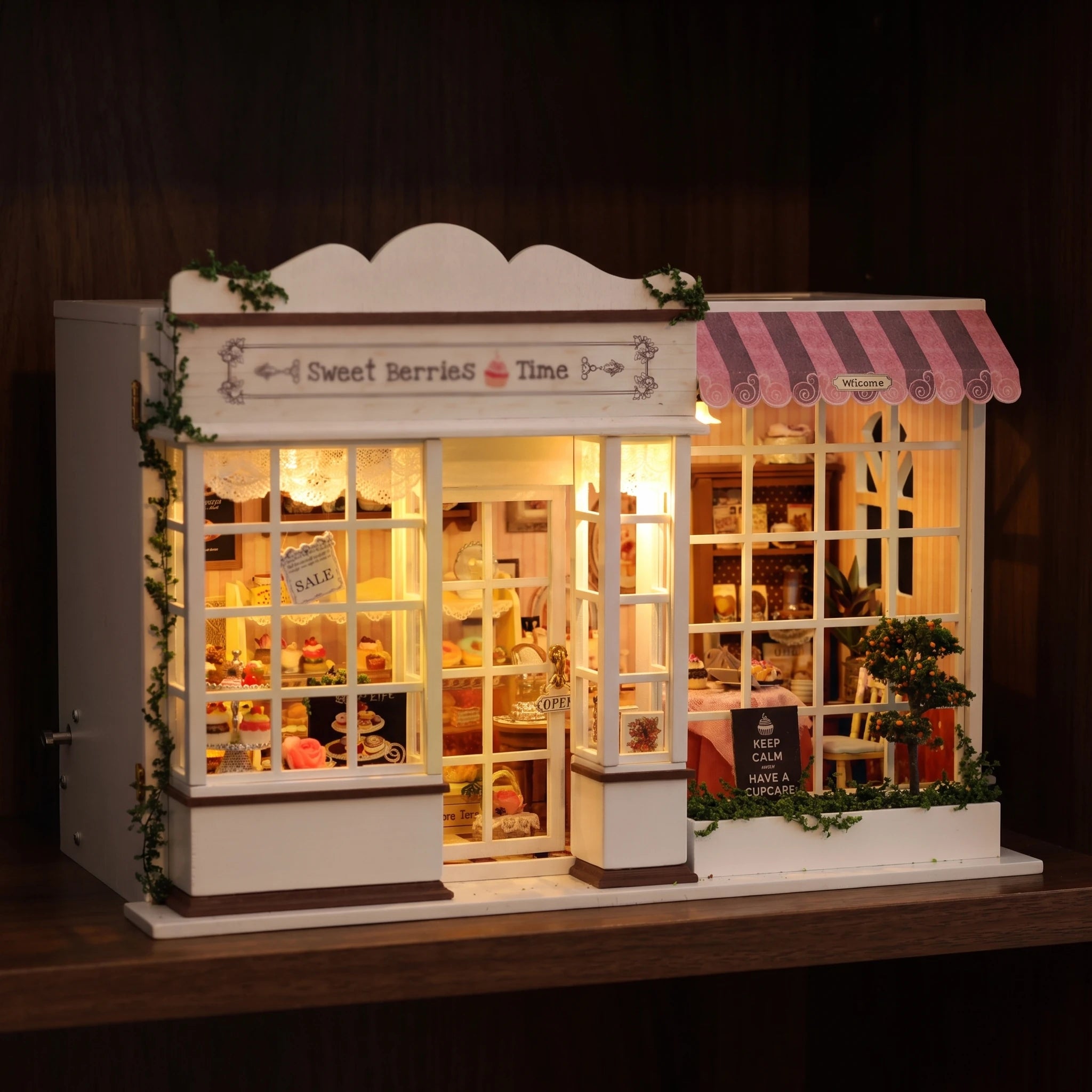 The Berry Bakehouse glowing on a walnut shelf at night