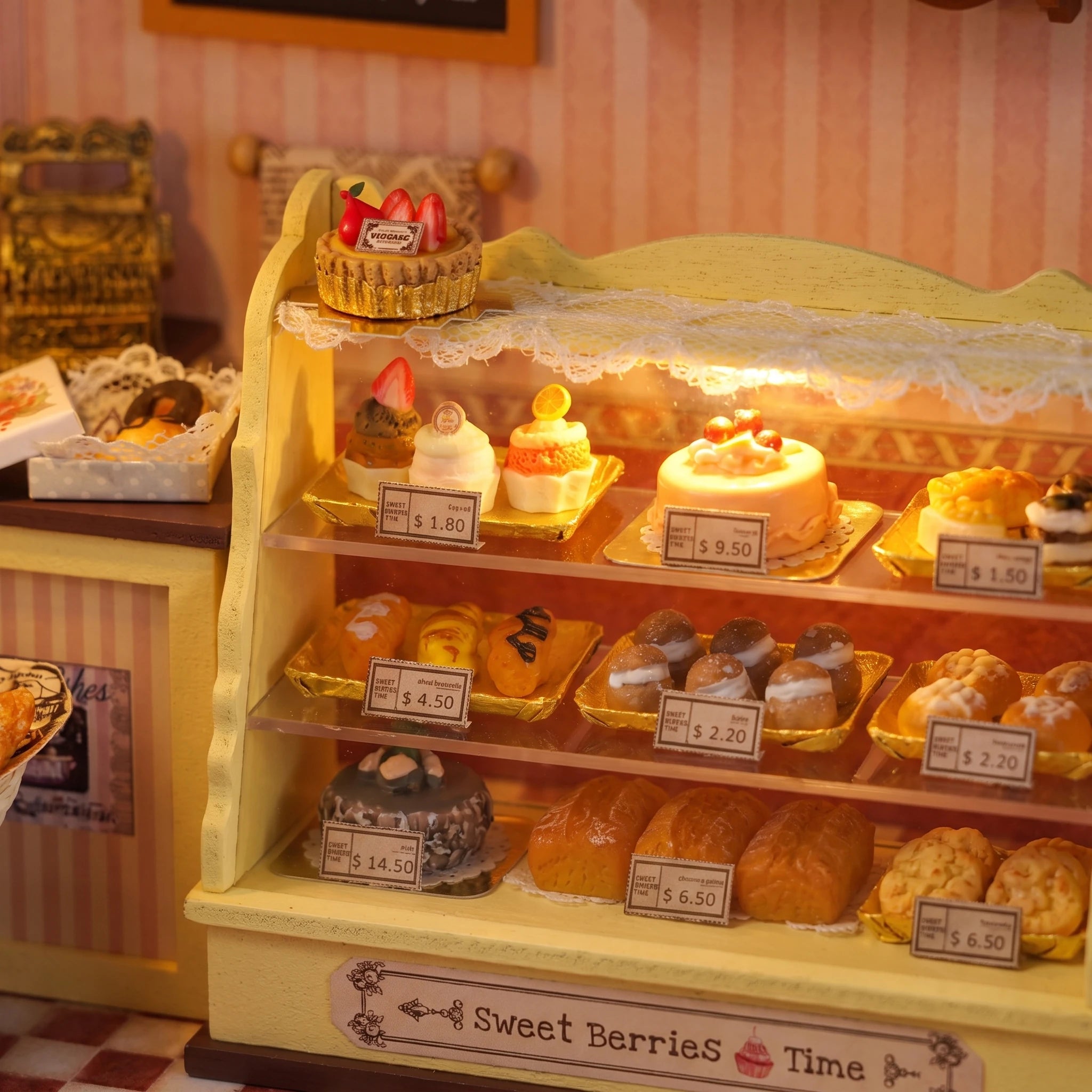 Cake counter detail: priced cakes and pastries in the display case