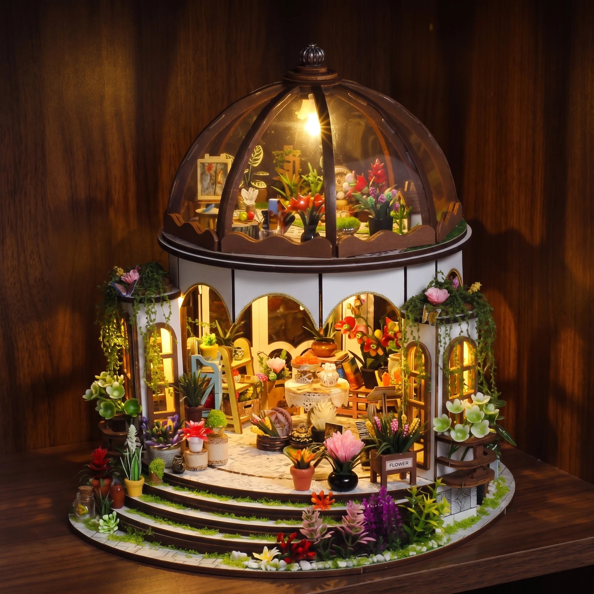 The Bloom Rotunda glowing on a dark walnut shelf at night