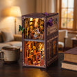 The Butterfly Archive book nook on a wooden desk beside a mug of tea and books