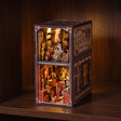 The Butterfly Archive book nook glowing on a dark walnut shelf at night