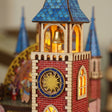 Macro of the clock tower with golden sun clock and bell