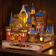 The Carousel Castle glowing on a walnut shelf at night