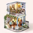 The Cello Corner DIY miniature music house kit, assembled with LED lights on
