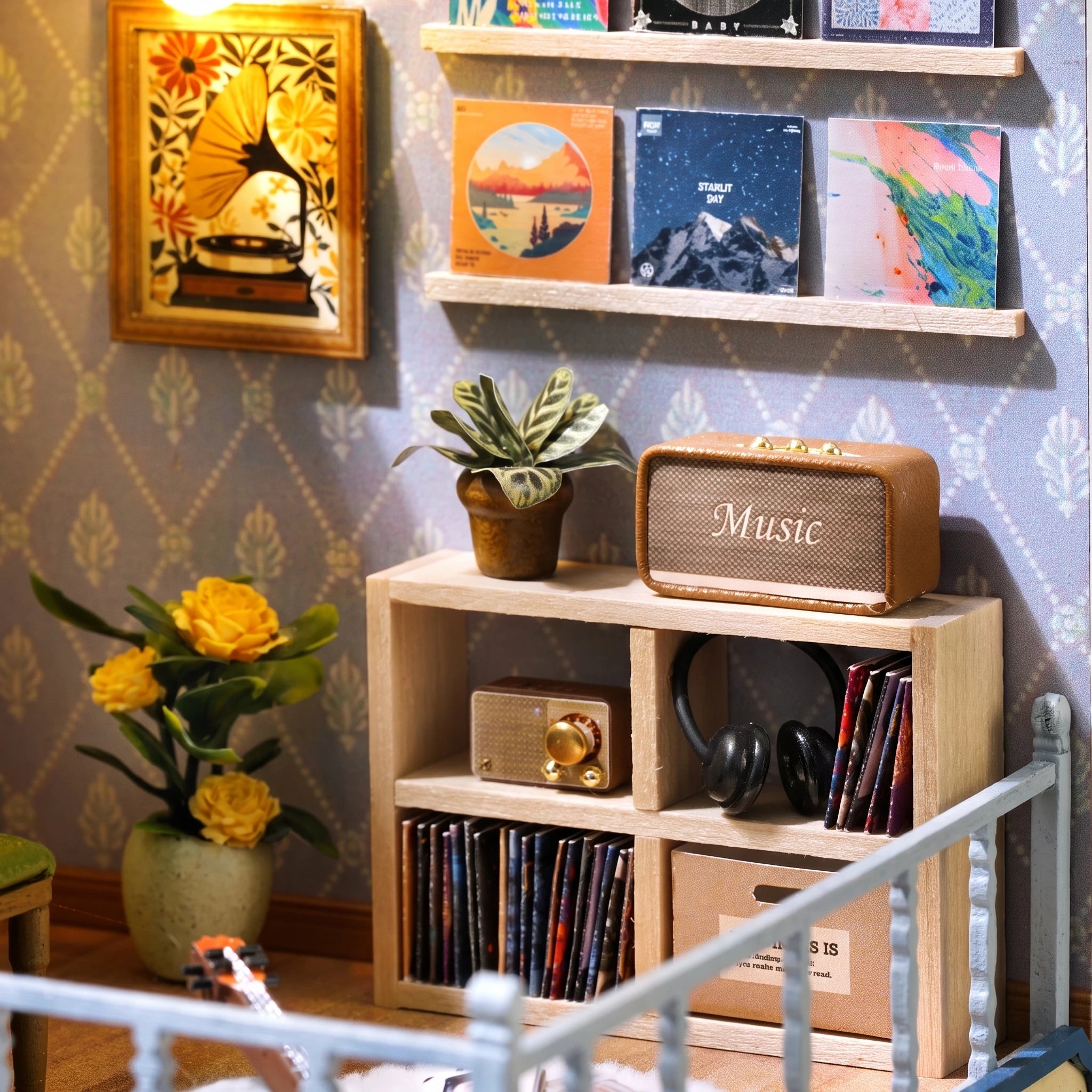 Upstairs studio detail: record wall, speaker and headphones