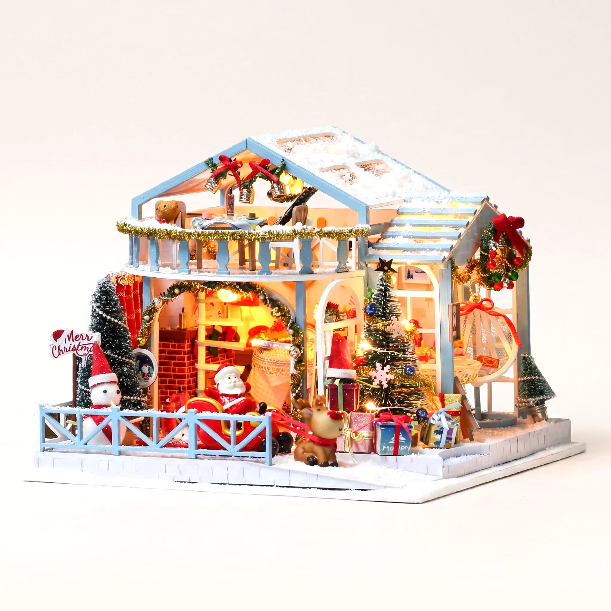 The Christmas Eve Lodge DIY miniature kit on a pale blush background