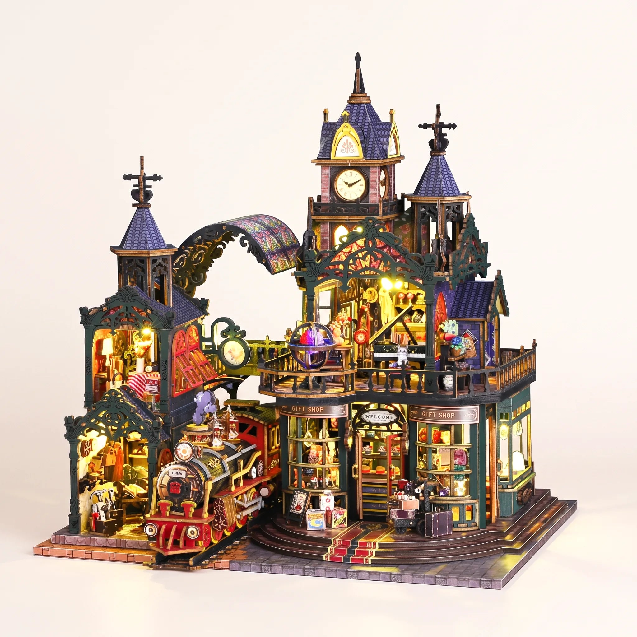 The Clocktower Emporium DIY miniature model kit with LED lights on, studio hero shot