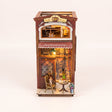 The Coffee House DIY book nook kit with LED lights on a pale blush studio background
