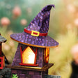 Purple witch hat chimney detail of The Crooked Cauldron