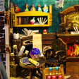 Crystal ball parlor and potion shelf inside The Crooked Cauldron